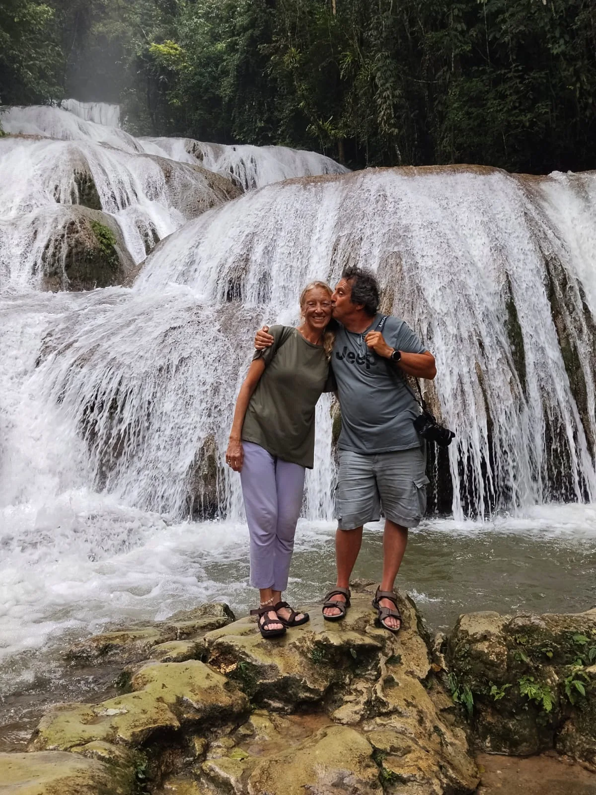 Travellers at Saluopa Waterfall near Lake Poso, Central Sulawesi