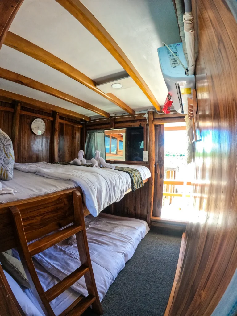 Beds and balcony door in the Merapi cabin on Dinara