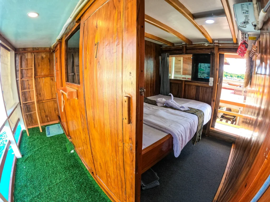 Tambora cabin door and private balcony on Dinara
