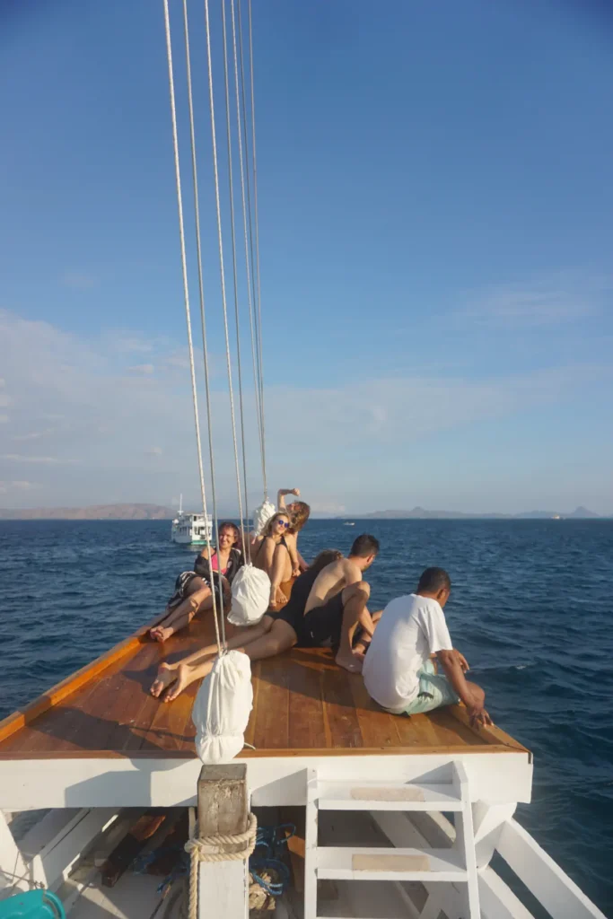 Guests on the bow of Dinara watching the islands go past