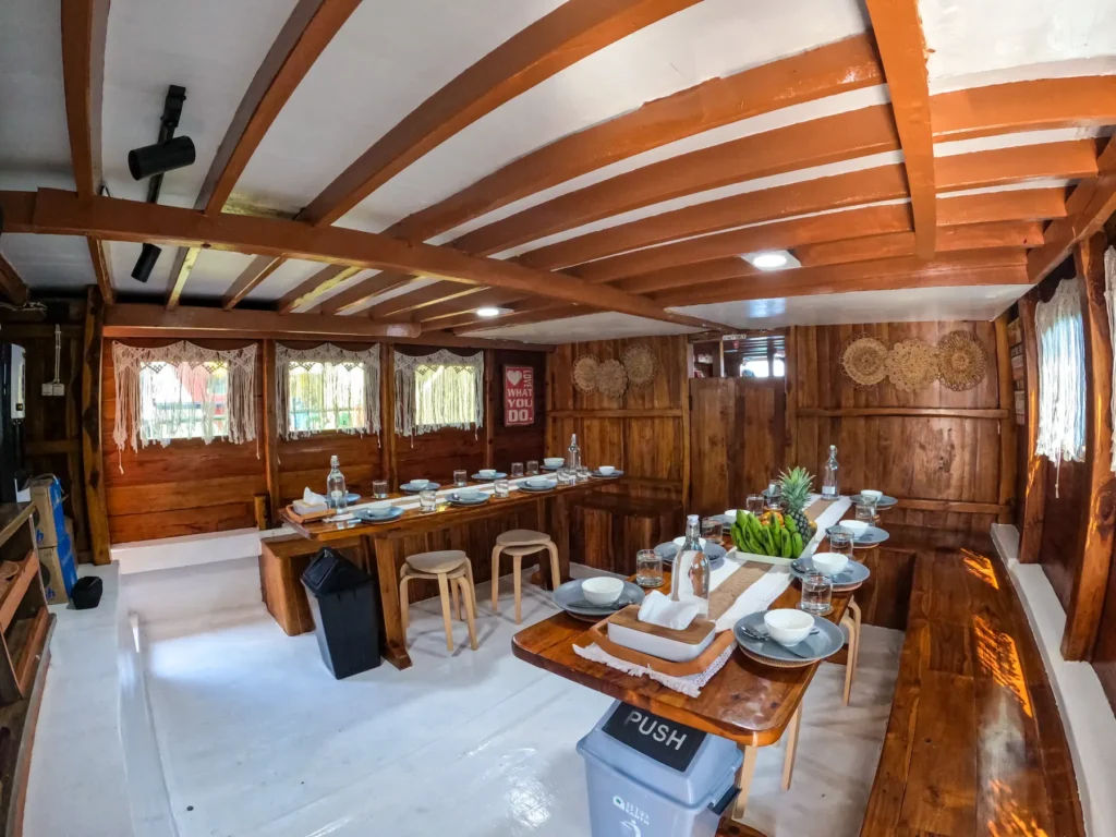 Dining tables and benches in the saloon of Dinara