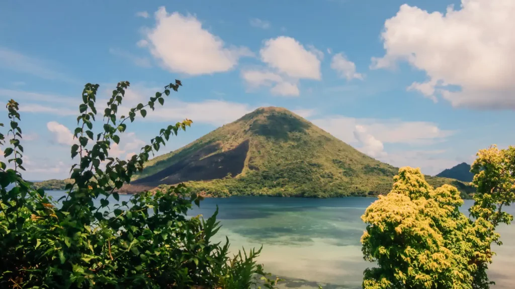 The volcanic cone of Gunung Api rising across the water from Banda Neira