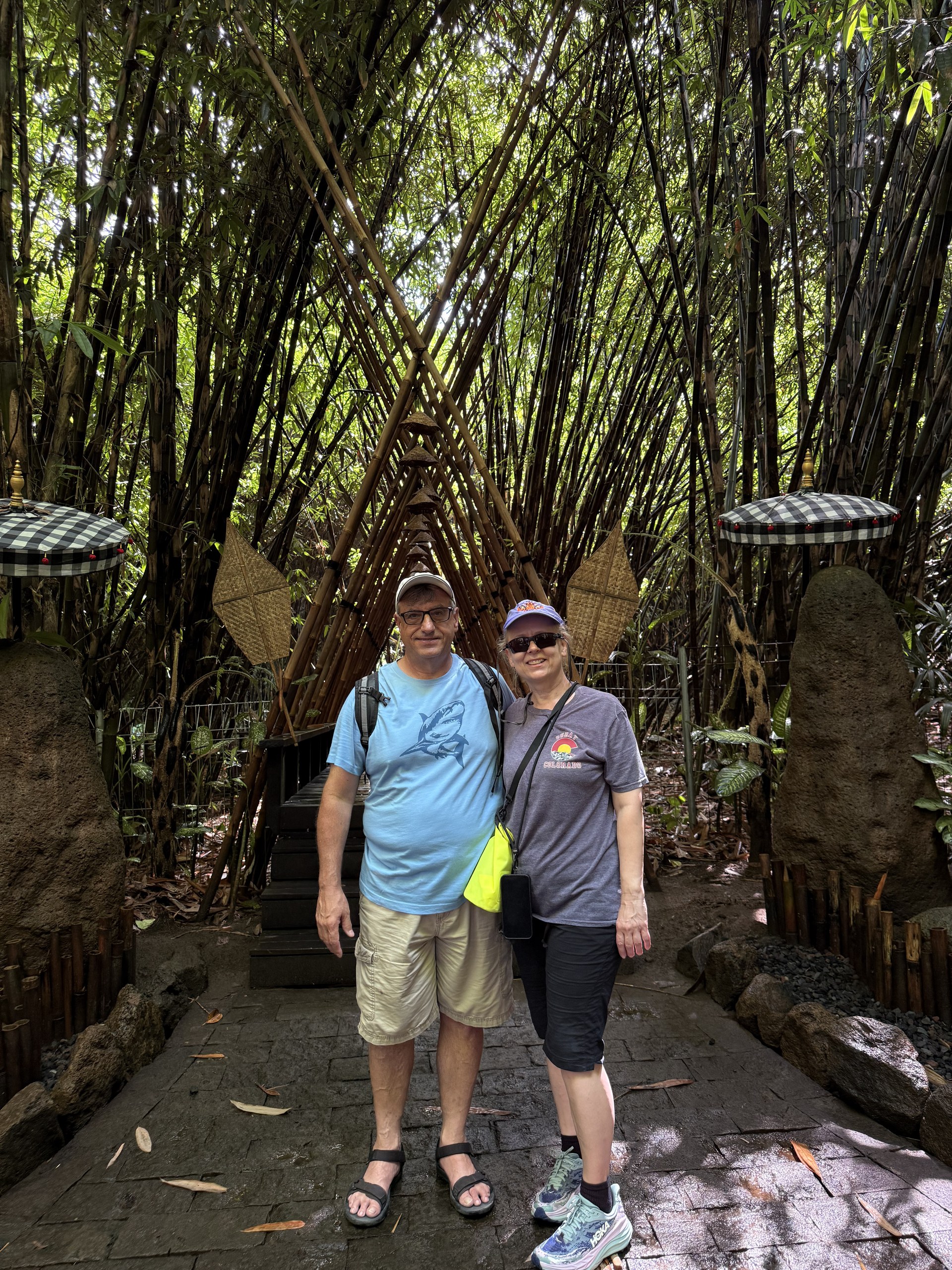Dean and Zita walking through a bamboo grove in Bali