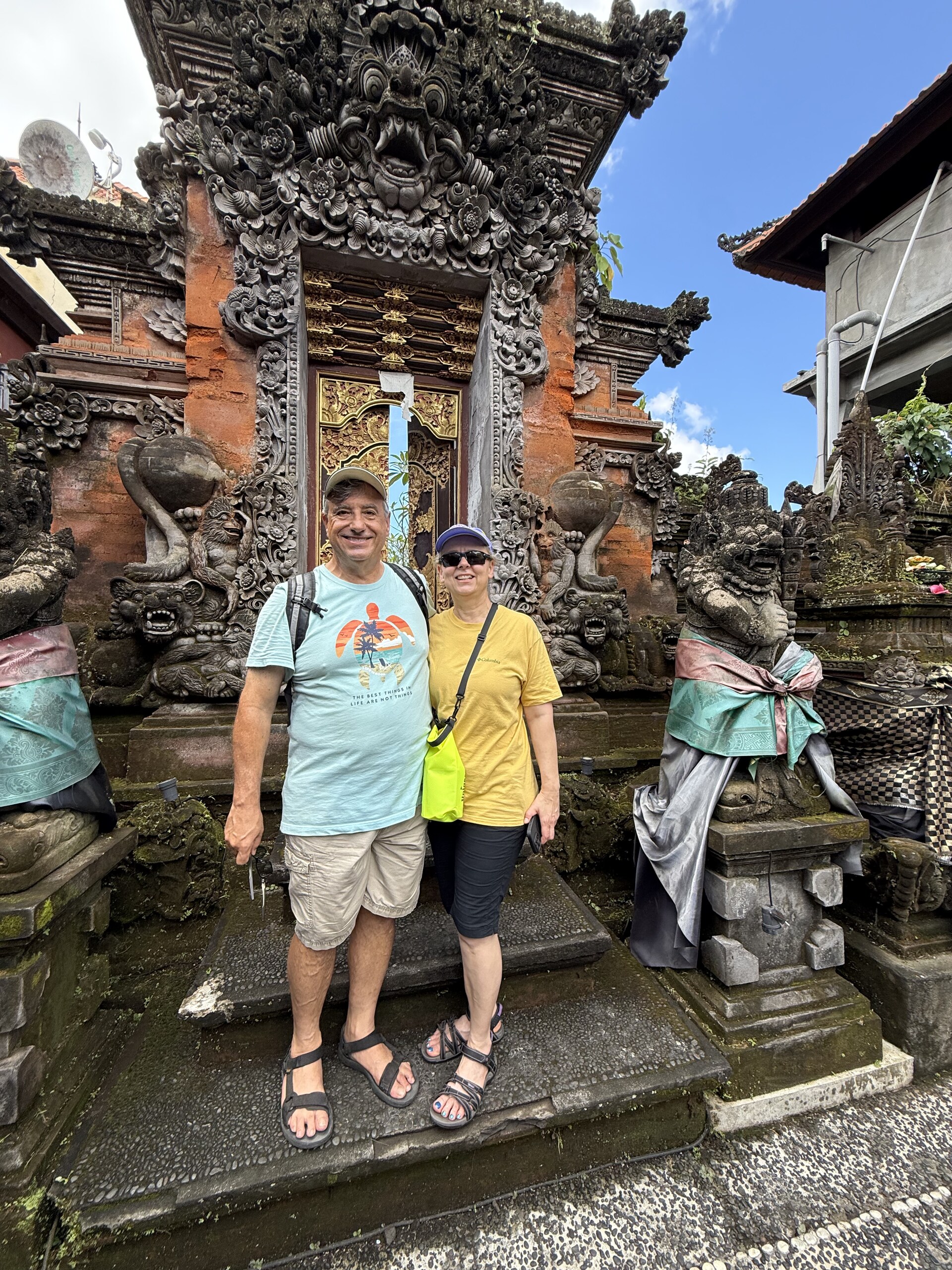 Dean and Zita at the carved stone entrance of a Balinese temple