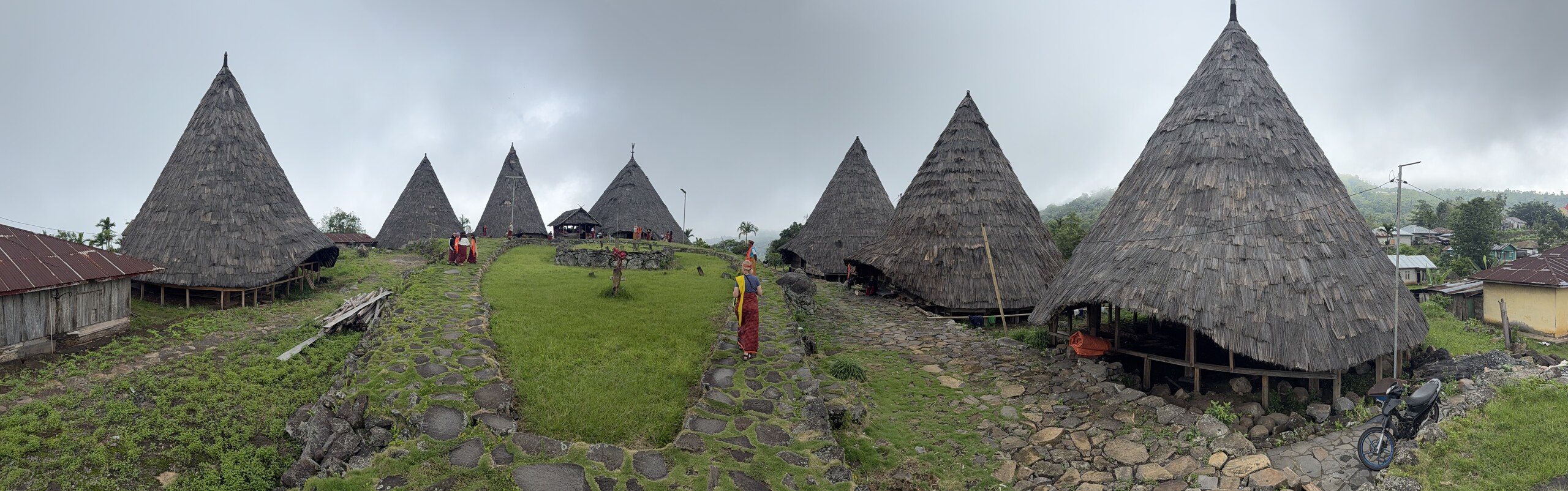 Panorama of the conical houses of Compang Todo village around a stone compound