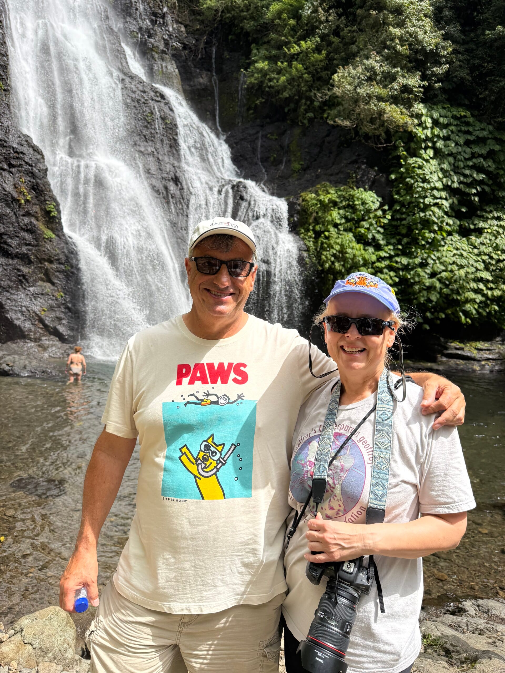 Dean and Zita standing in front of a waterfall in Bali