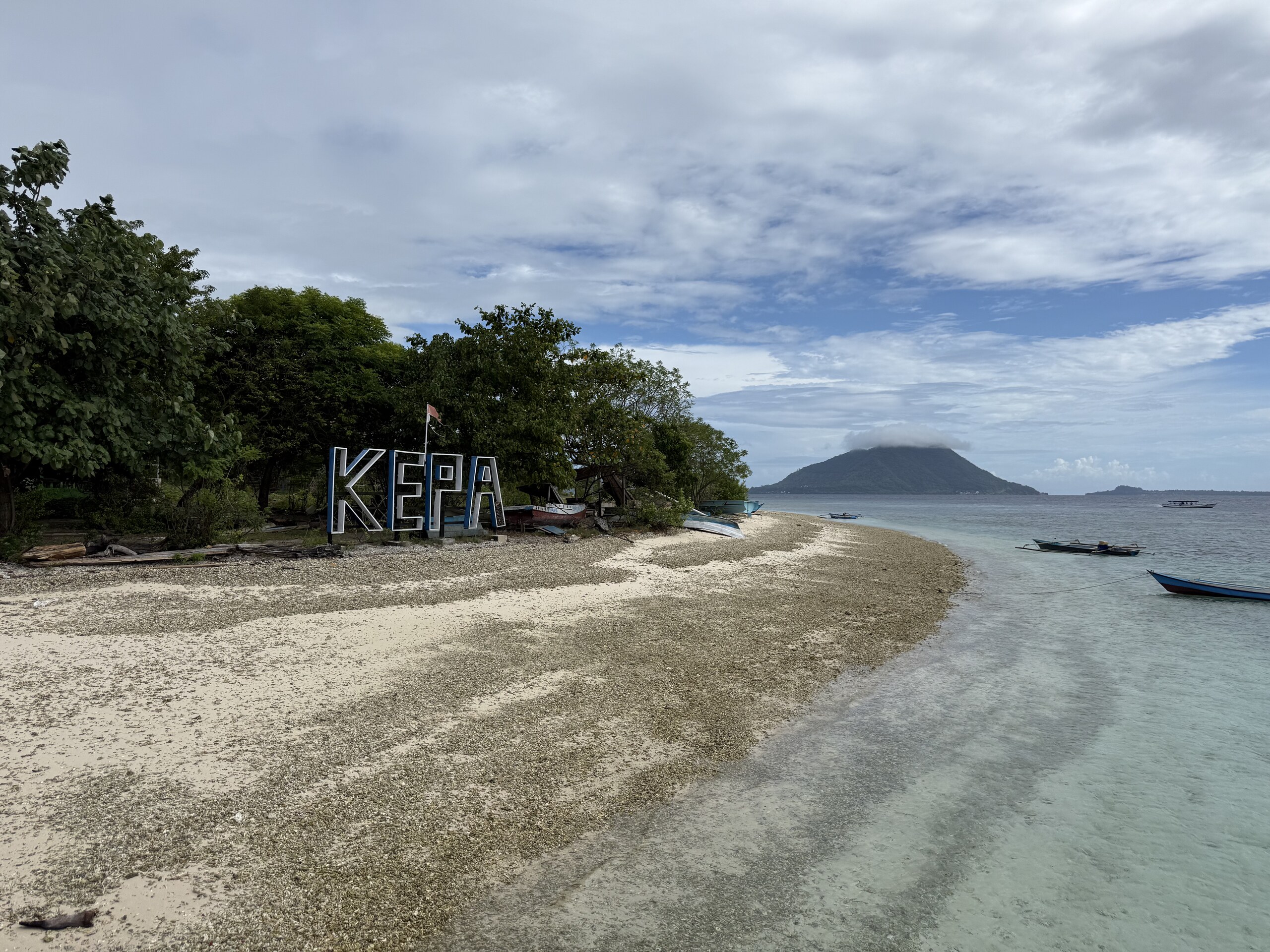 The word Kepa spelled out in stones on the beach of Kepa island in Alor
