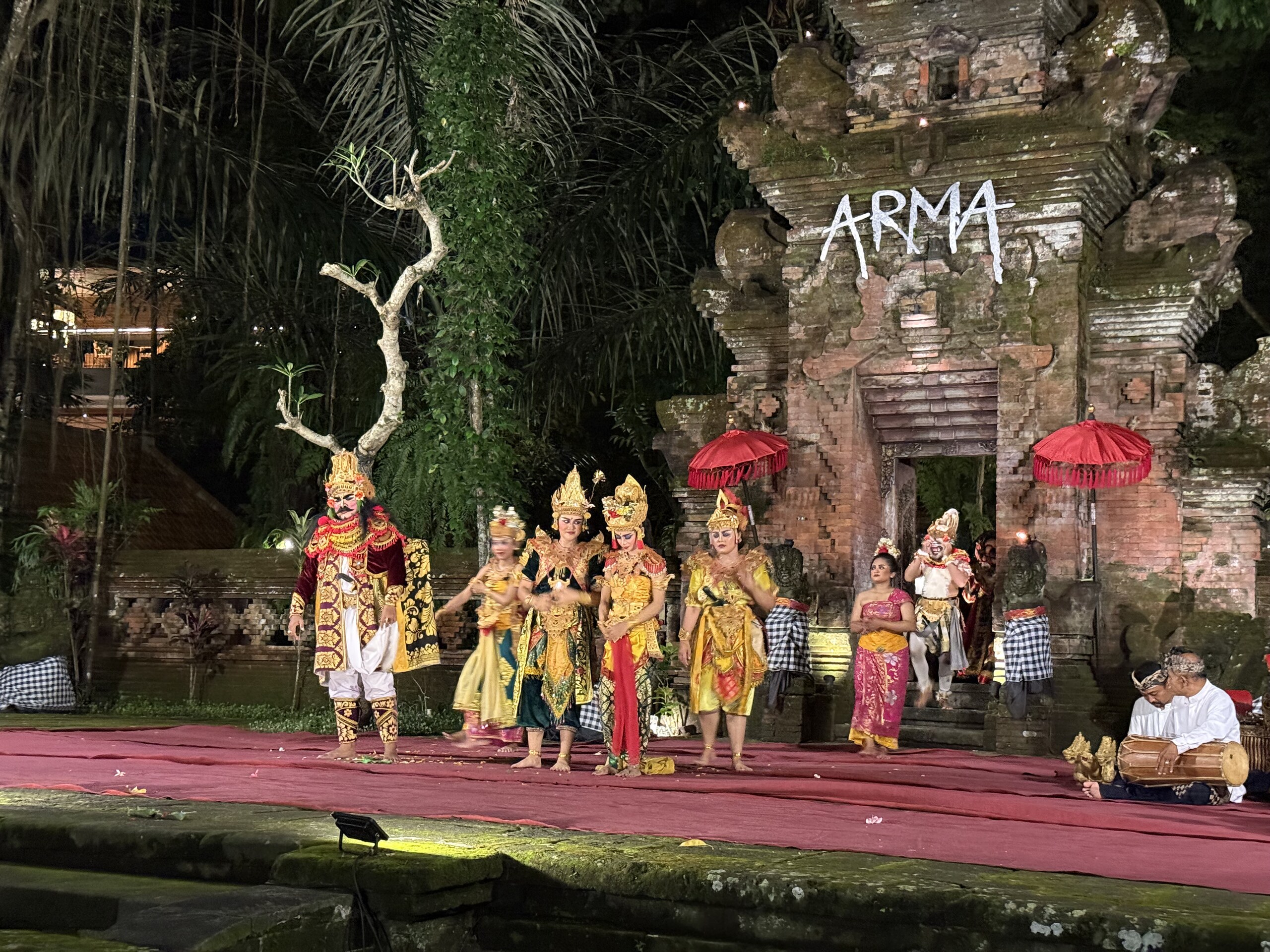 A Balinese dance performance on an outdoor stage in Ubud