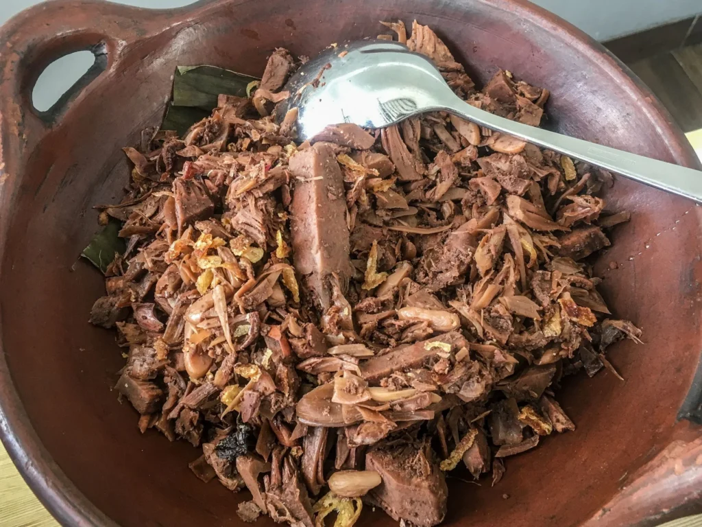 Gudeg, young jackfruit slow-cooked in coconut milk, in a clay pot