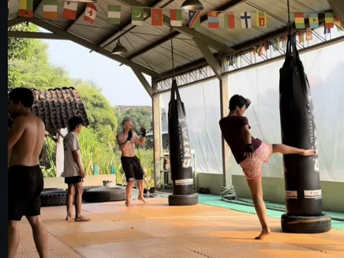 Muay Thai training on heavy bags at Jogja Camp Academy