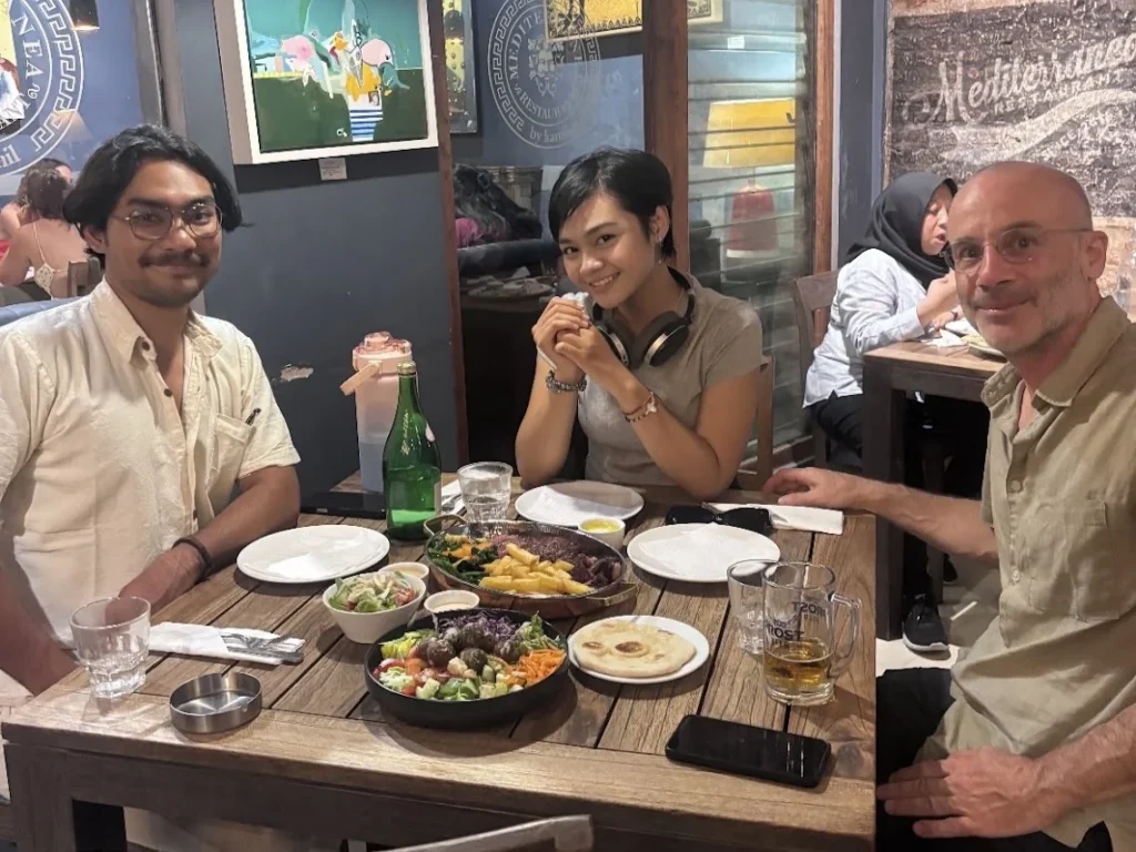 Diners at a table at Masama by Kamil restaurant in Yogyakarta