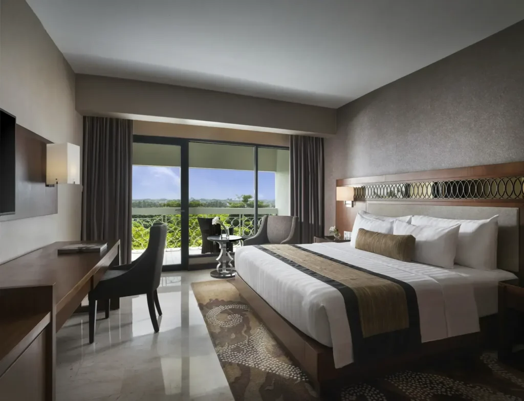 Deluxe king room with a balcony at the Royal Ambarrukmo hotel in Yogyakarta