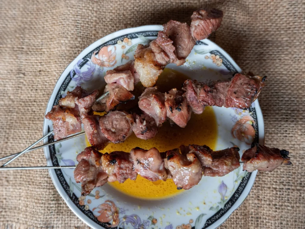 Plate of sate klathak goat satay with broth