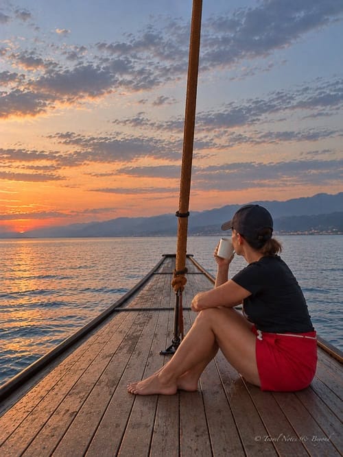 Anda with a morning coffee at the bow of Al Fatran 3
