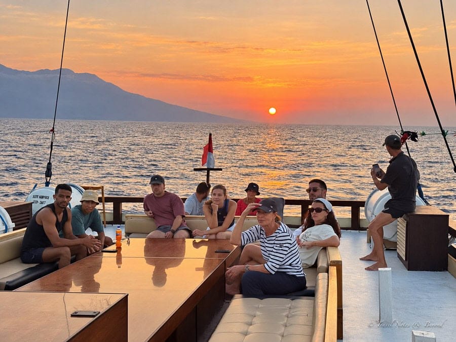 Guests on the aft deck of Al Fatran 3 at sunset