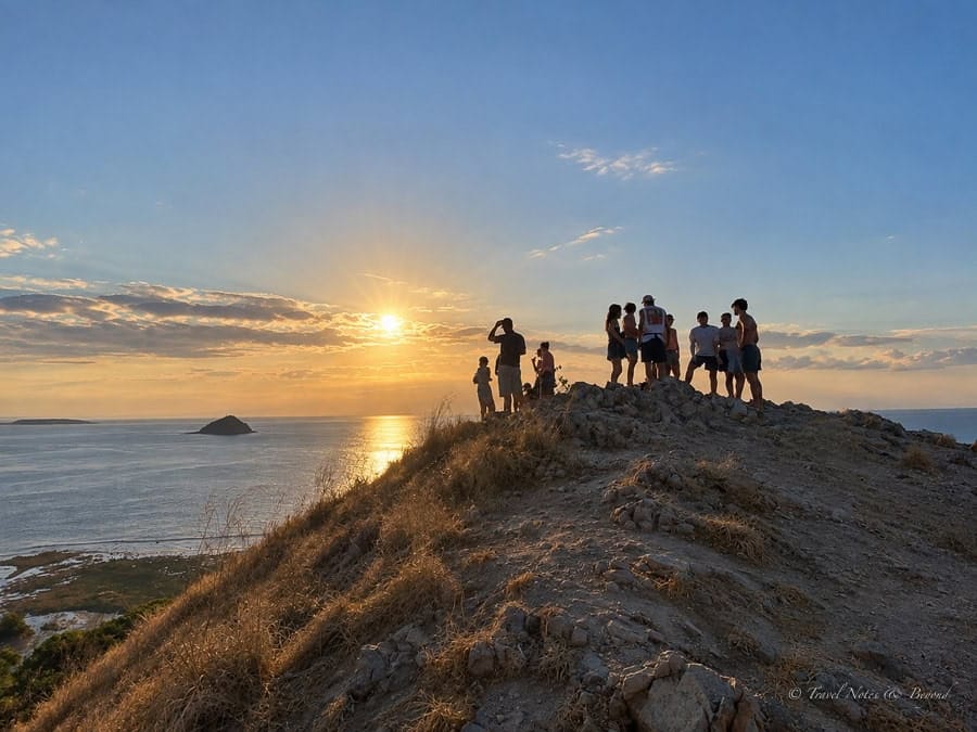 Guests watching the sunset from the hill on Kenawa Island
