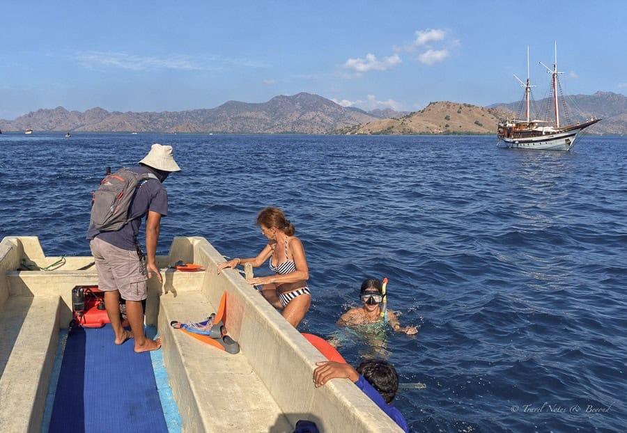 Guests climbing back into the tender after drifting over Manta Point
