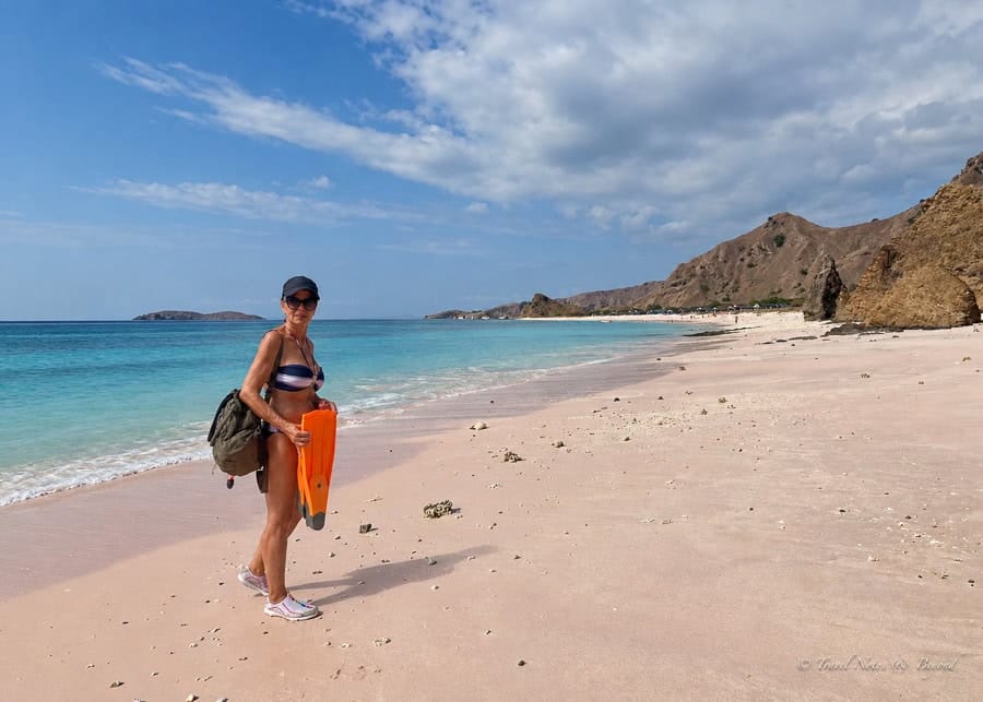 Anda walking along the pink sand at Pink Beach, Komodo