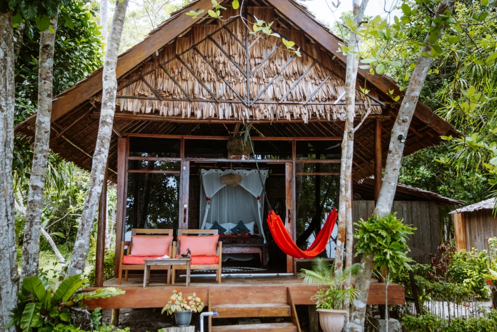 Superior Cottage with its terrace, sofas and hammock among the trees