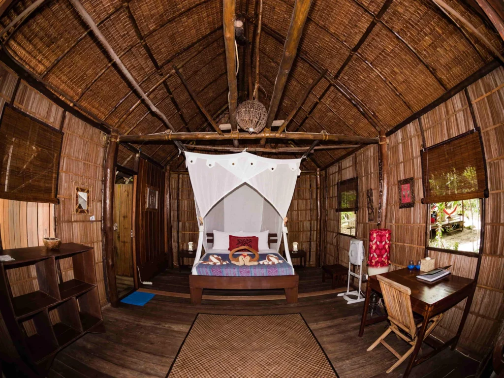 Superior Cottage bedroom with a mosquito net over the bed